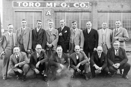 Orville Clapper (front row, second from left  the youngest son of Toros first president, John Samuel Clapper), T.L. Gustin (back row, sixth from left  an original Bull Tractor employee), and exporter Henry Jahn (not pictured) set up Toros first distributorship in New York in 1922.