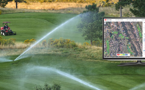 Image of a commercial Toro mower on a golf course with active sprinklers and a monitor with a visual of a map superimposed on the image.